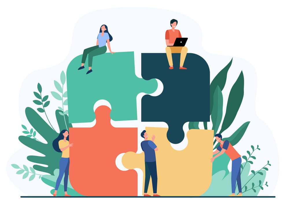 Illustration de 4 personnes qui sont chacune sur un morceau de puzzle. Une fois assemblés, les 4 morceaux de puzzle sont cohérents et forment un tout. L'image illustre le fait de s'appuyer sur le bouche-à-oreille et sur des partenaires locaux pour améliorer le référencement de son site local et pour gagner en notoriété et en réputation.